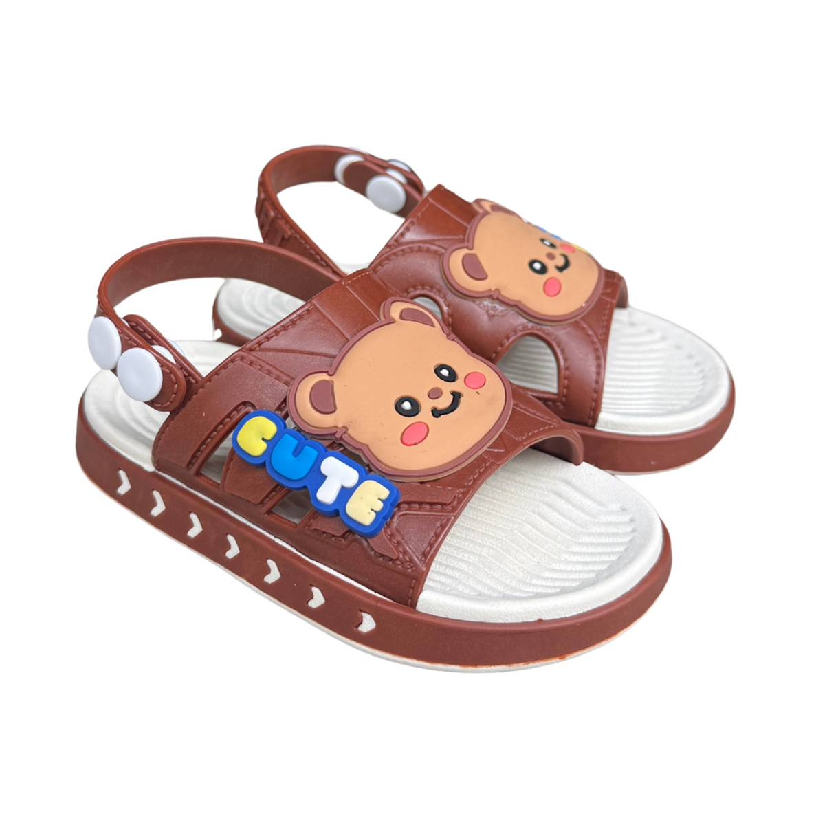 Pair of brown Cute Teddy sandals for boys, with a “Cute” teddy bear on the front and a heel strap, non-slip sole, cushioned
