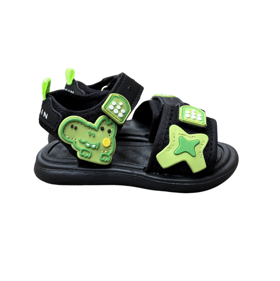 Pair of green Coco Star sandals for boys, with star and dice appliqués and fastening straps