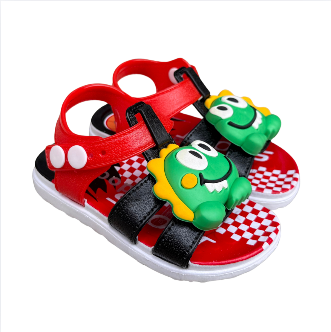 Pair of black Dino Baby sandals for boys, with green dinosaurs on the front and a checkered insole