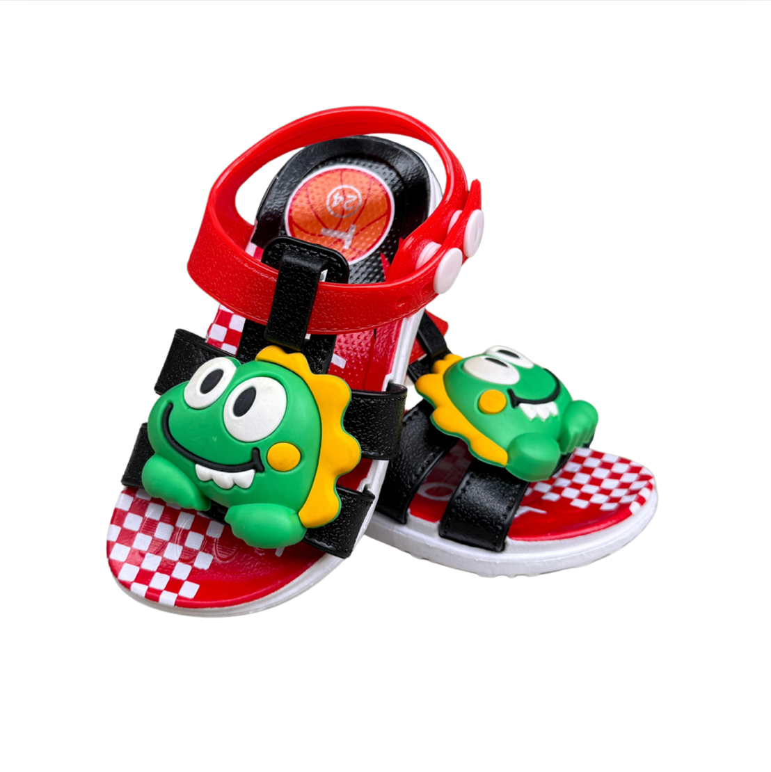 Pair of black Dino Baby sandals for boys, with green dinosaurs on the front and a checkered insole