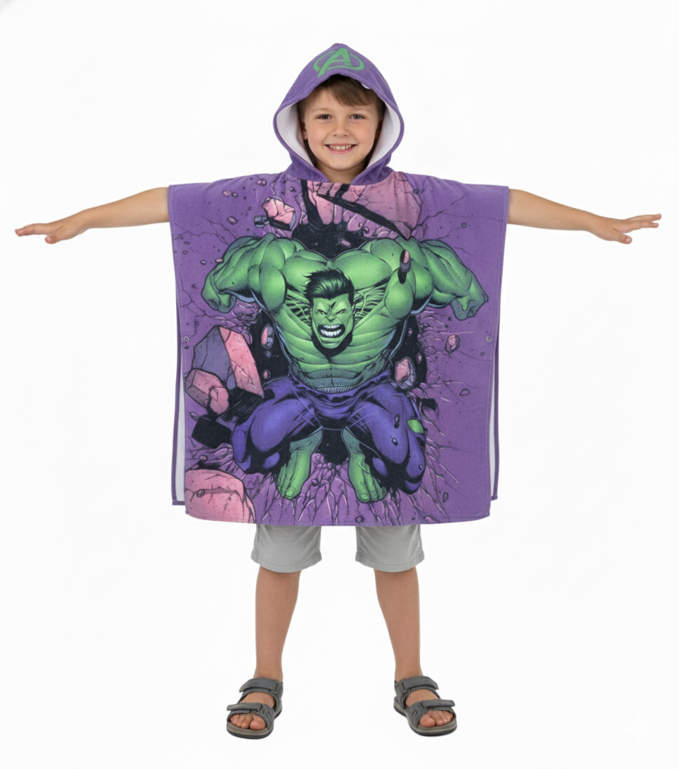 Boy wearing the Hulk poncho towel, purple with Hulk, hooded, microfiber