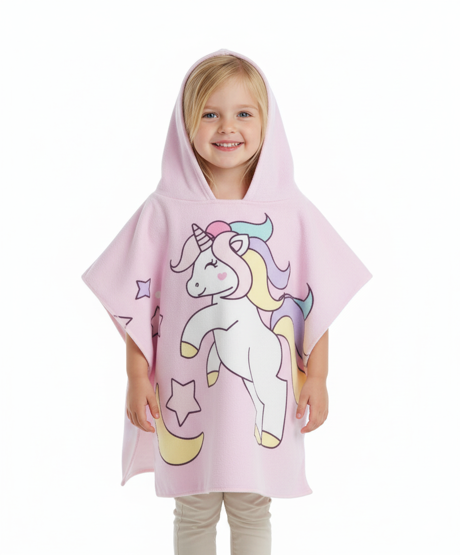 Girl wearing the Unicorn Moon poncho towel, light pink with a unicorn, moon and stars, hooded, in microfiber