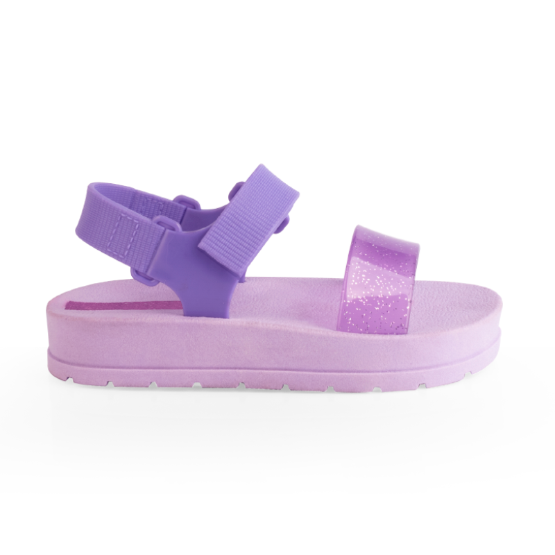Sandalia Moderniña lila para niña, de plataforma con tira con brillo y velcro, vista de lado, suela antideslizante